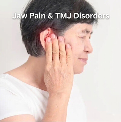 Woman holding her jaw and ear in discomfort demonstrating TMJ pain symptoms treated at Heal Physiotherapy and Chiropractic in North York